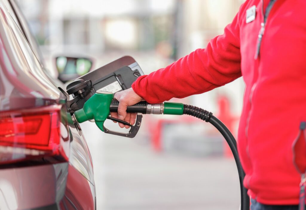 Man fueling car with biodiesel.